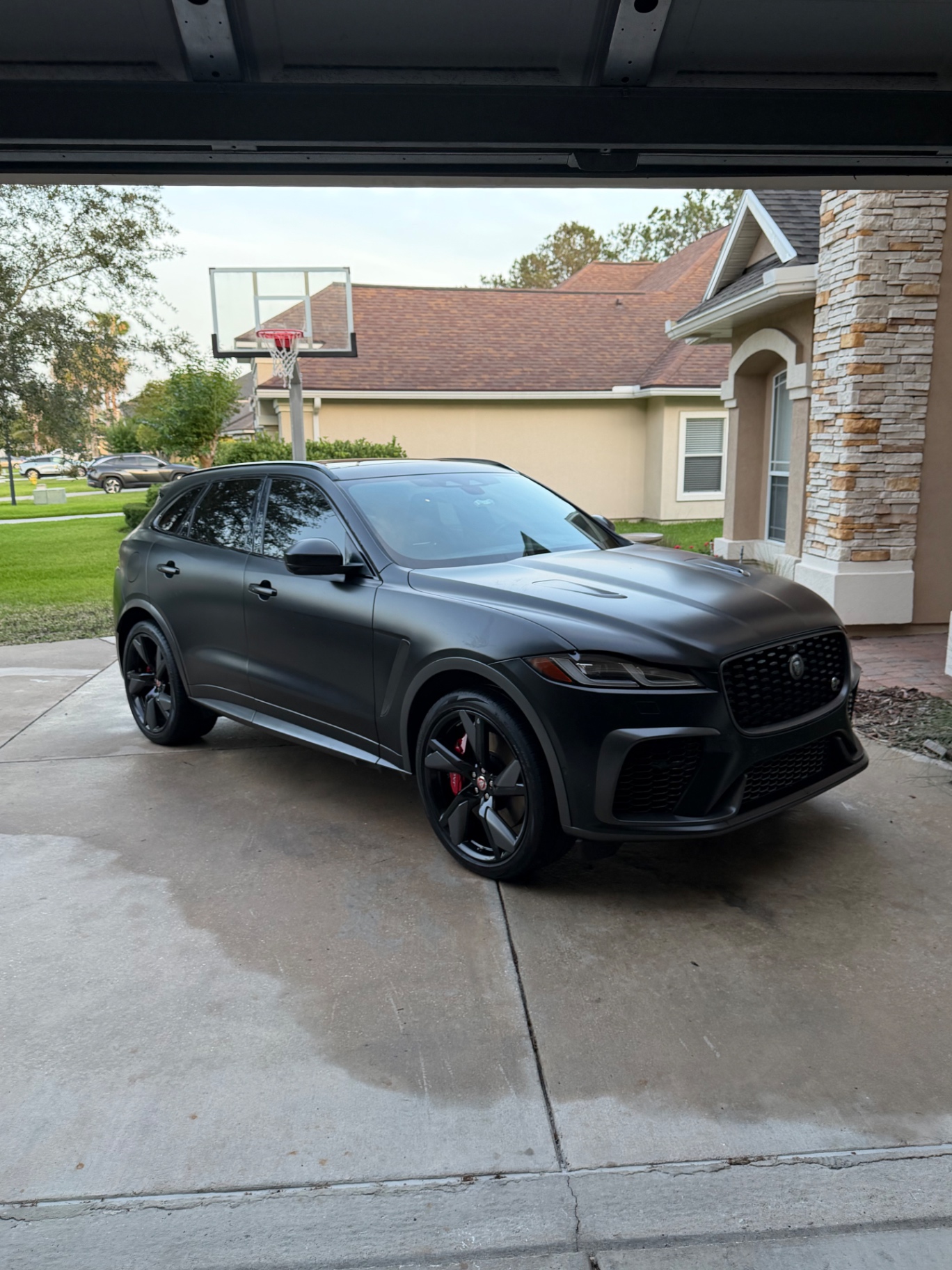 Matte black Jaguar F-Pace SVR detailed in customer driveway